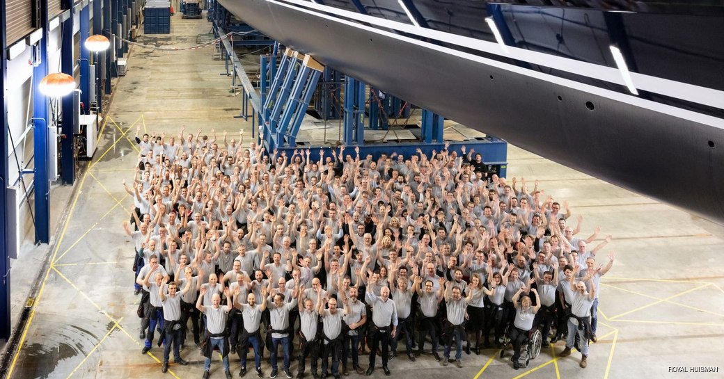 Sea Eagle II superyacht with workers from Royal Huisman waving 