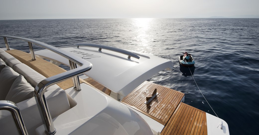 transom door opens on the swim platform of charter yacht DINAIA  