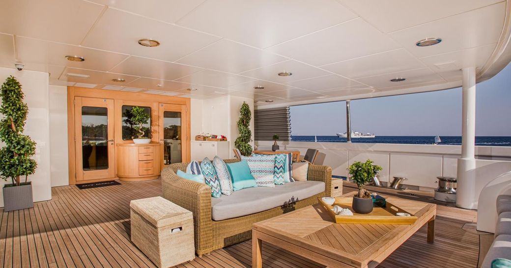 Exterior lounge area onboard luxury yacht rental MARLA