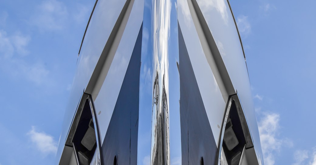 Ground level view looking directly up at the bow of superyacht GO