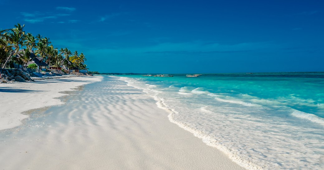 White sand beach and bright blue sea in Africa