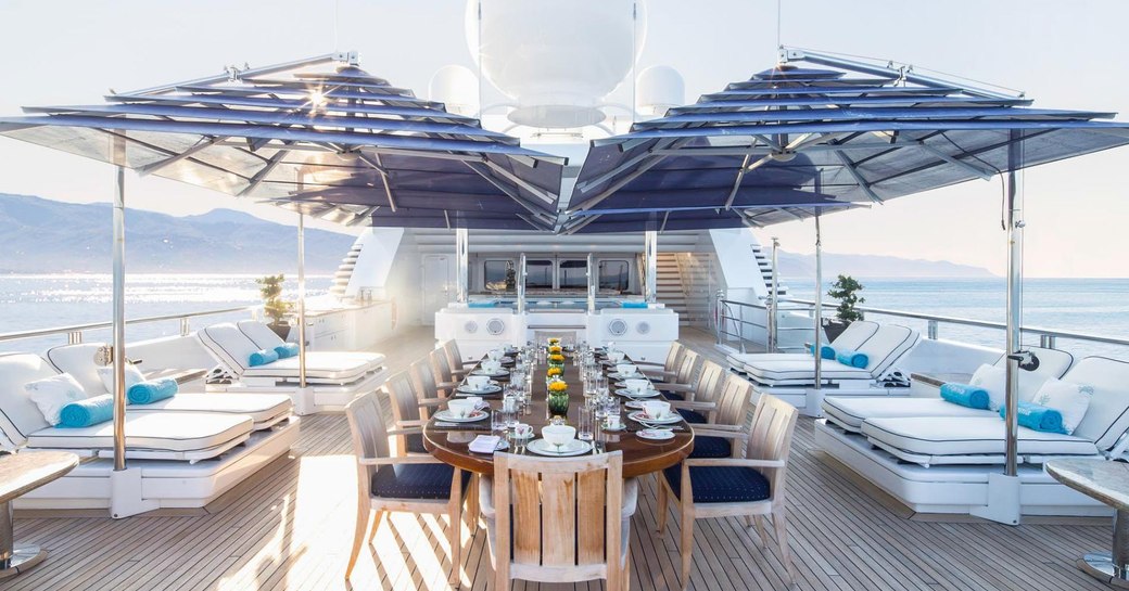 alfresco dining setup on upper deck aft of luxury yacht TITANIA 