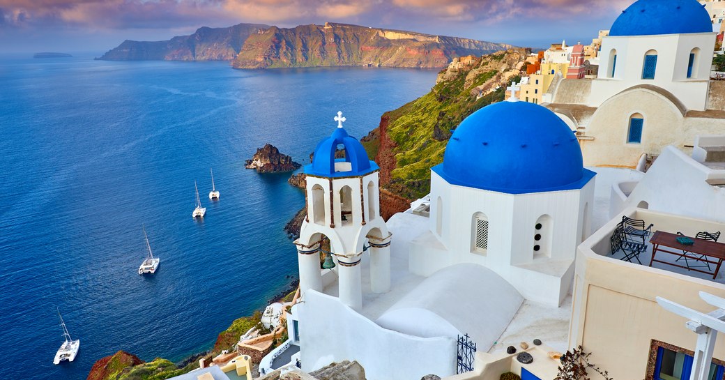 Town of Santorini, with blue rooves and white plaster buildings, aerial shot