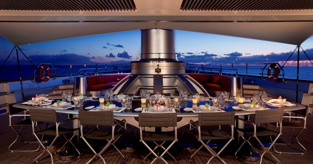 Al fresco dining at night onboard sailing yacht Maltese Falcon