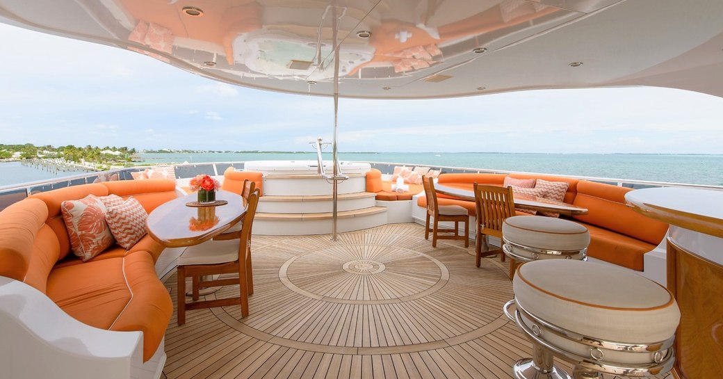 jacuzzi, seating and bar stools on the sundeck of luxury yacht EXCELLENCE