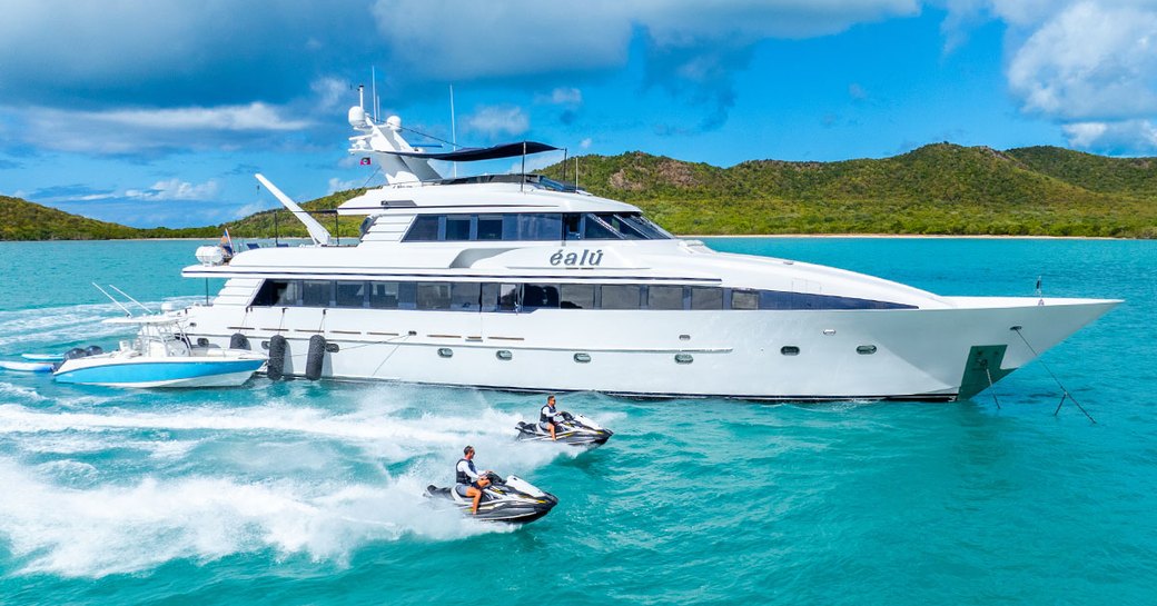 Charter yacht EALU at anchor with water toys alongside