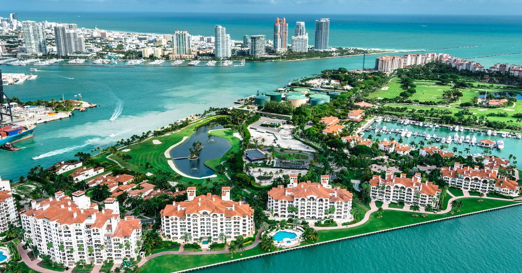 Aerial view of Florida. Large hotels surrounded by water, views out to sea in background.