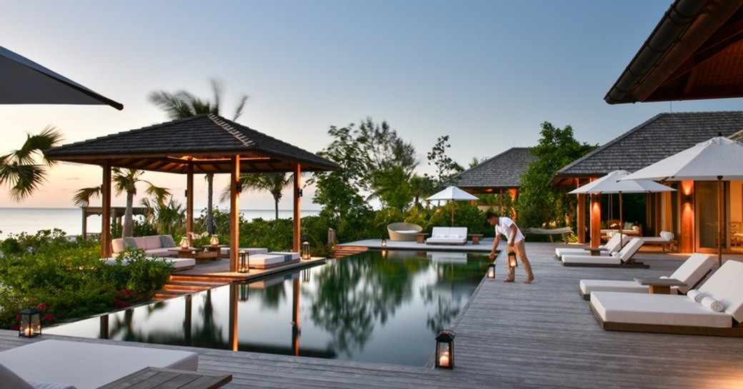 A spa attendant tends to the pool at the Como Shambhala in Turks & Caicos