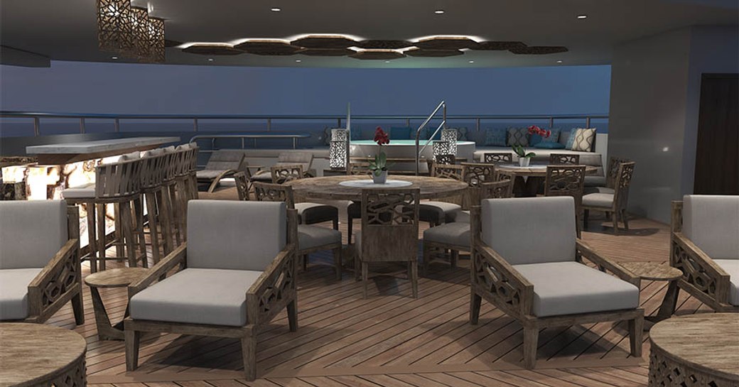 sun loungers, dining table, bar and spa pool on the sundeck of charter yacht ELITE 