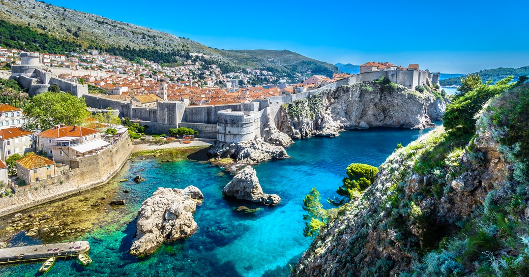 Clear blue water with ancient city walls Dubrovnik