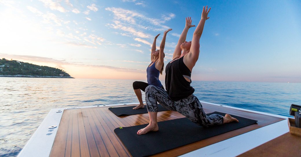 tow best friends welcome the new day by doing their morning yoga salutations to the sun 