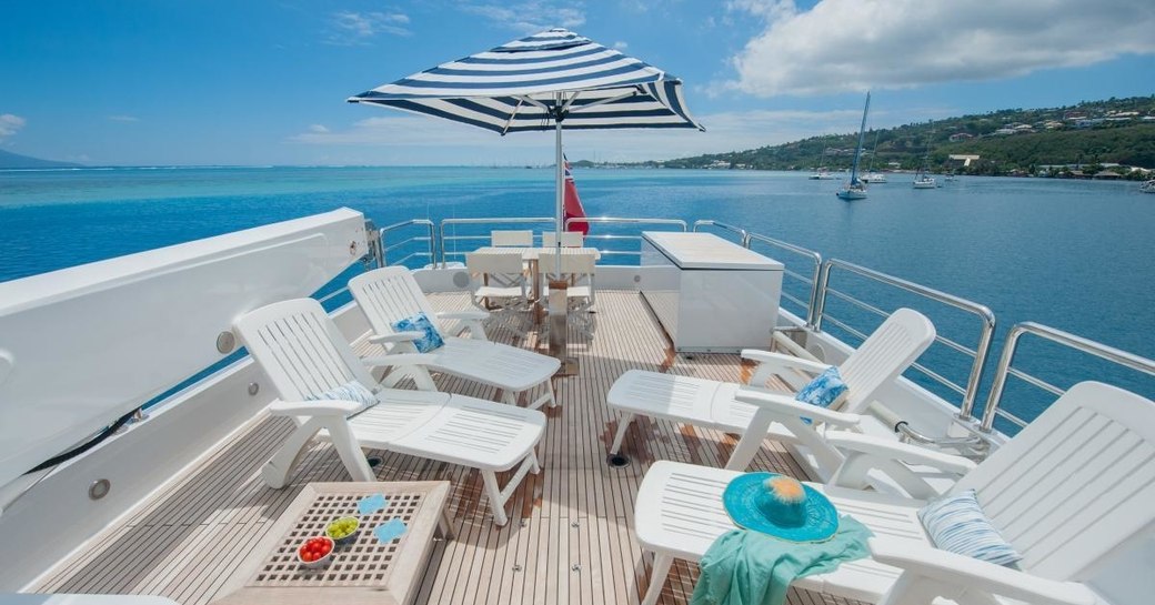 chaise loungers lined up on sundeck of superyacht DREAMTIME 