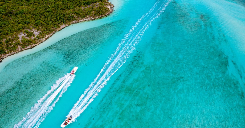 bahamas yachts gliding across water