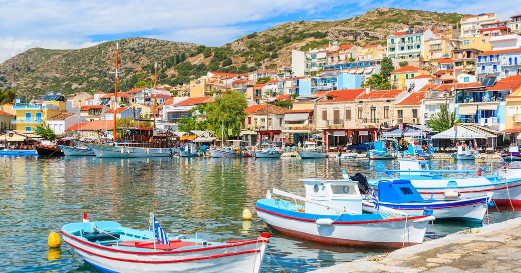 Traditional colourful Greek fishing boats in Pythagorion port, Samos island, Greece