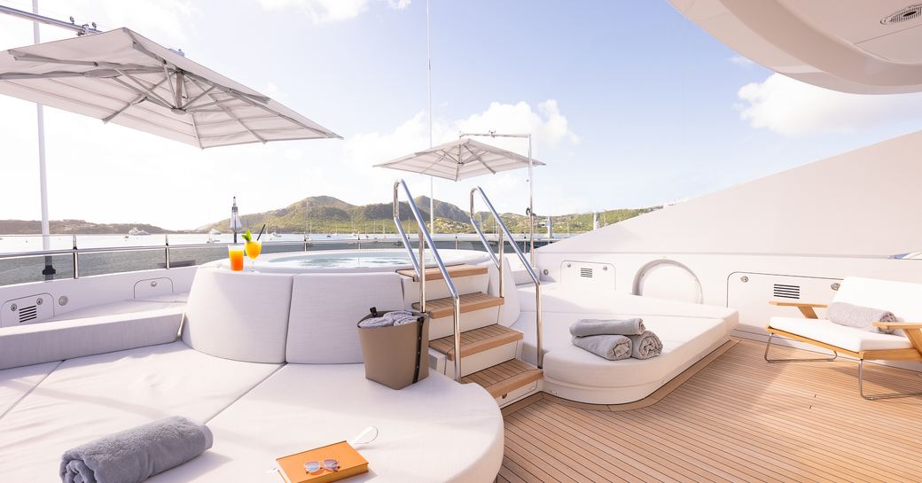 Deck Jacuzzi and sunpads onboard charter yacht RELIANCE