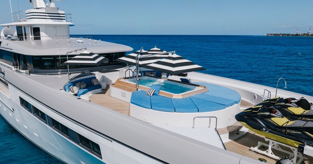 Deck Jacuzzi and sun pads onboard charter yacht ETERNITY