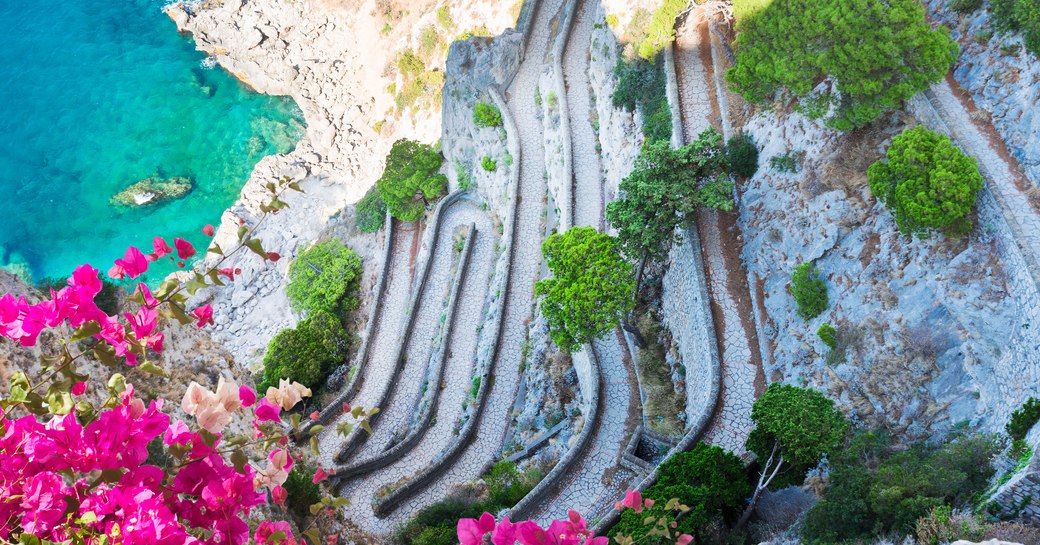 Lovely path in Capri overlooking the Mediterranean sea