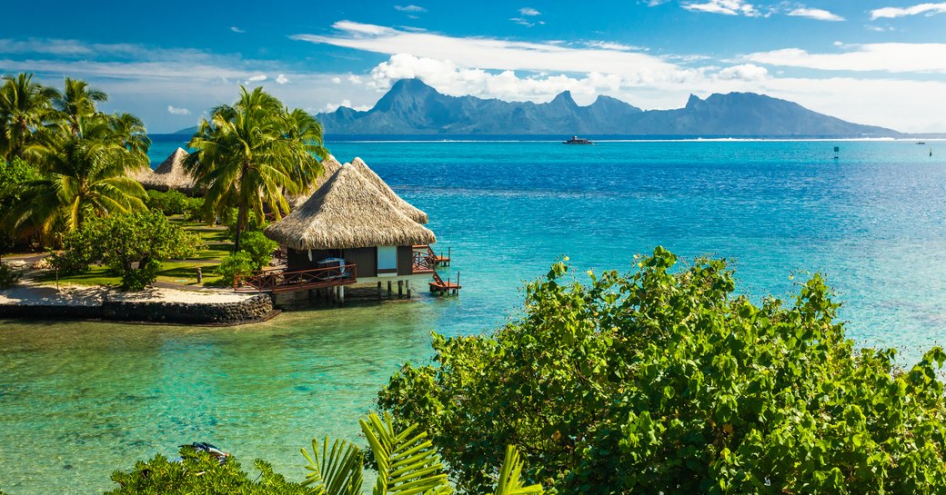 Overwater bungalows with best beach for snorkeling, Tahiti, French Polynesia