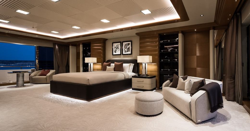 Master cabin with central berth and seating area onboard charter yacht MAR