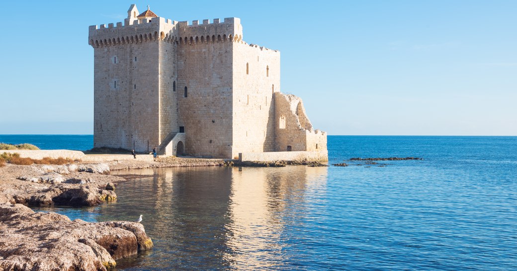 Well-preserved fortified ruins of a medieval monastery by the sea on the island of Saint Honorat