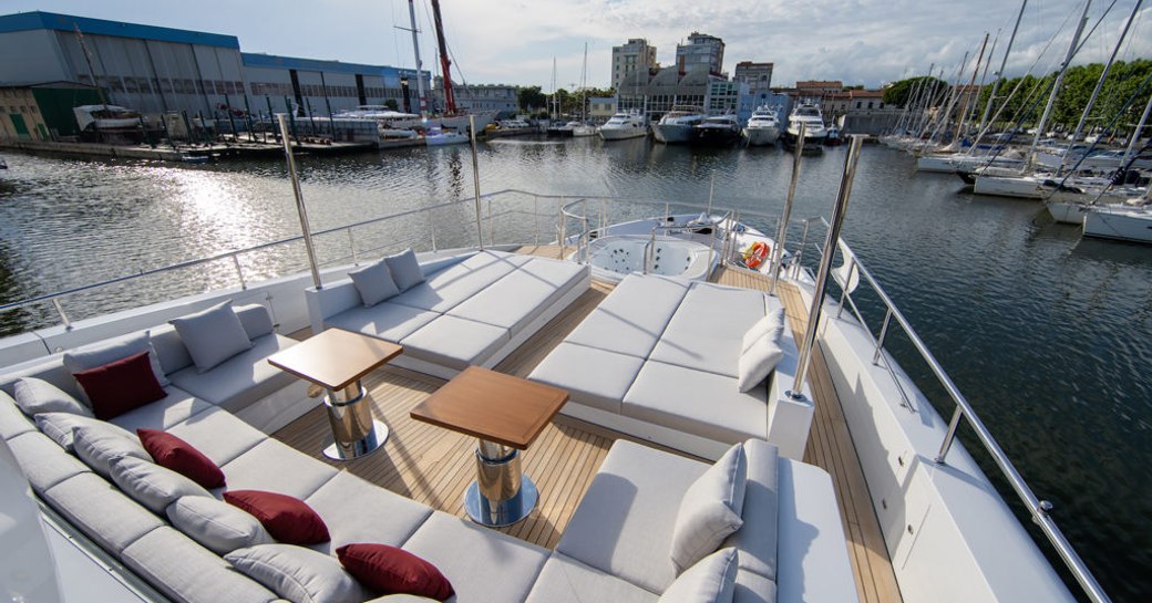 superyacht happy me foredeck area, with coffee tables and sunpads