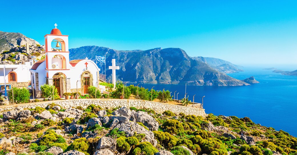 Greek church on a cliff overlooking the sea