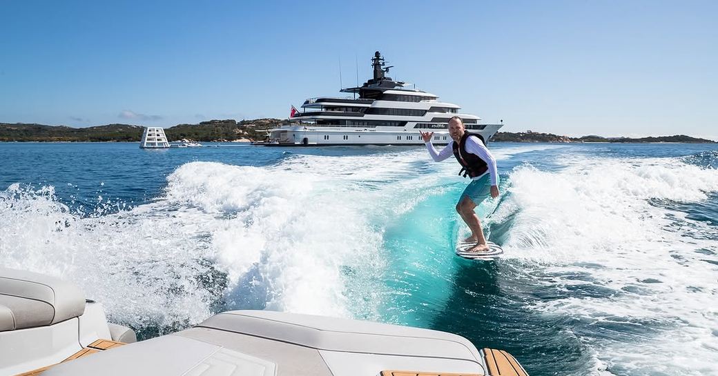 Charter yacht STARFIRE charter guest enjoying watersports 