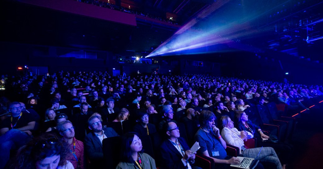 Cinema environment at MIPCOM, audience watching screen.