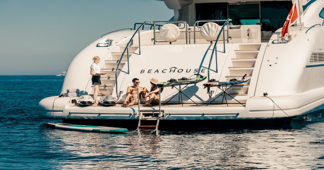 couple chatting by the sea on their yacht vacation