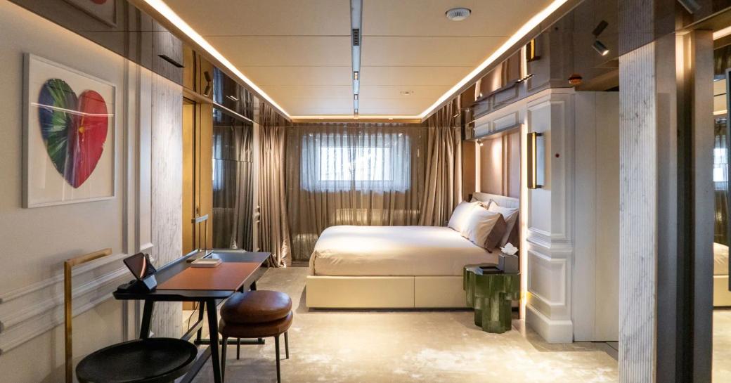 VIP cabin with central berth and desk onboard charter yacht RAJA² 