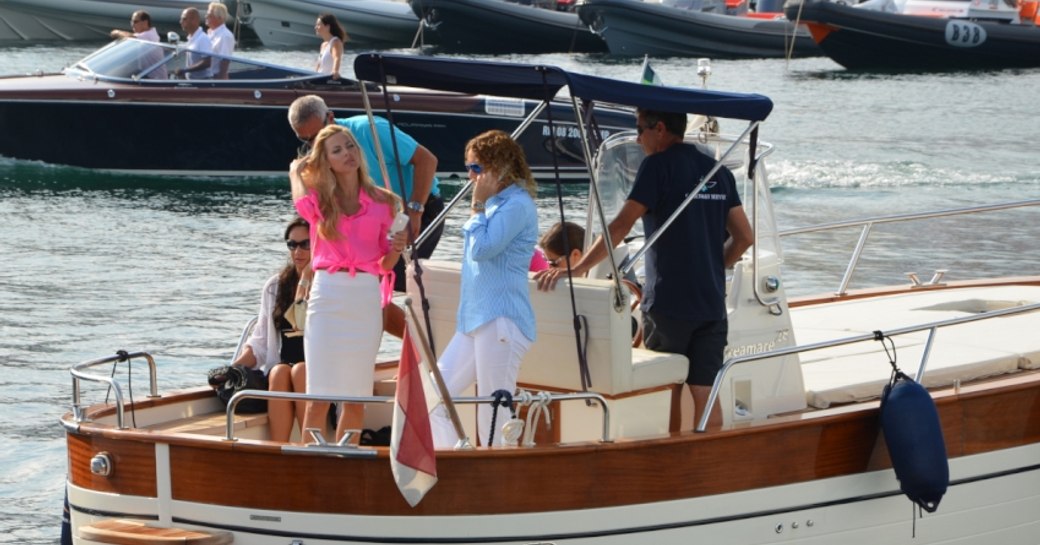 Clients on board a luxury water taxi at the Cannes Yachting Festival