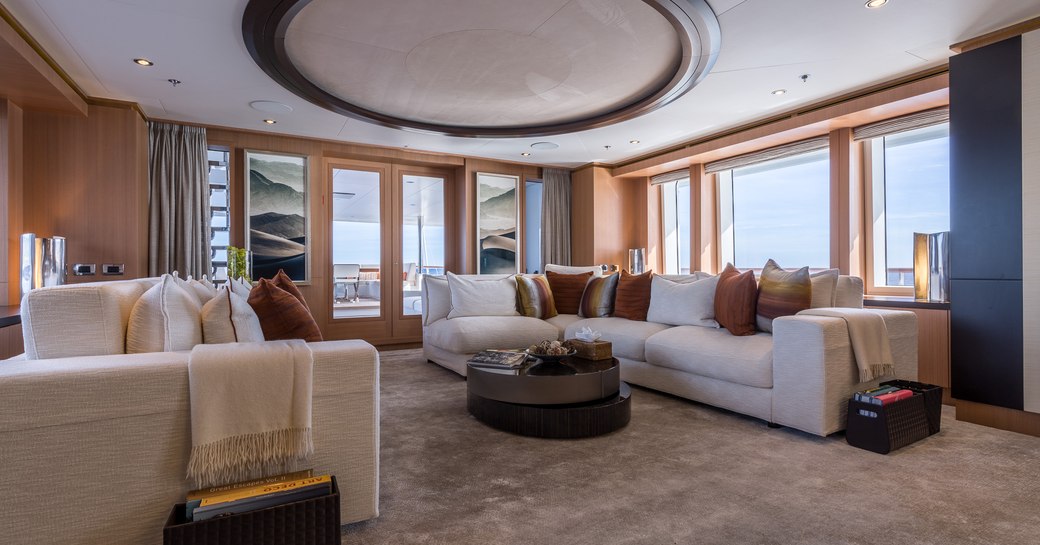 calm and casual main salon with sumptuous sofas on board superyacht GO