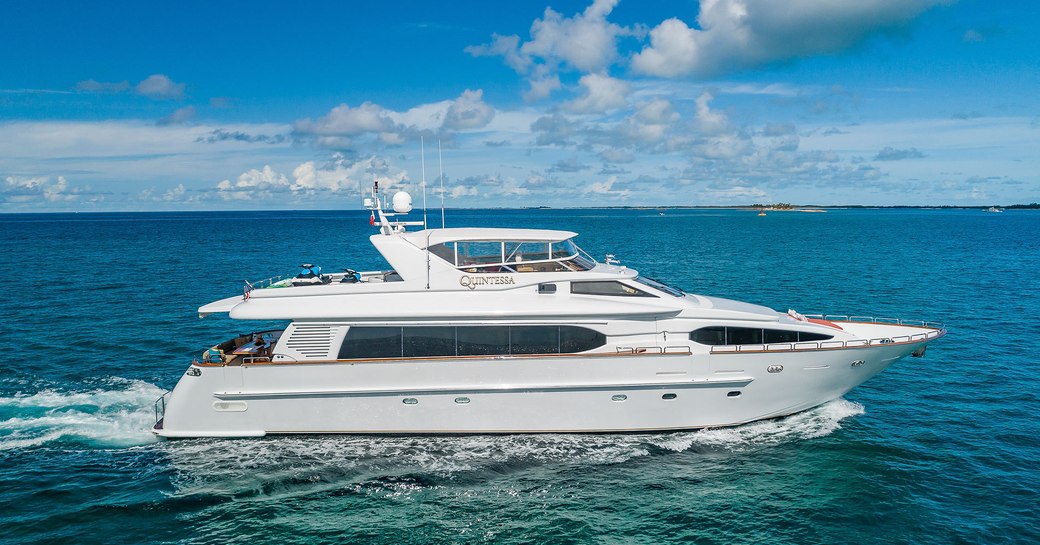 motor yacht quintessa underway on the clear turquoise waters of the Caribbean