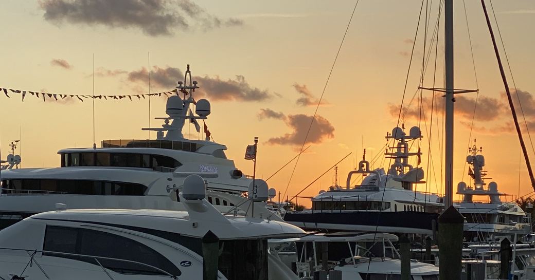 a beautiful sunset casting the motor yachts at FLIBS 2019 in a demure lights as the event reaches its end