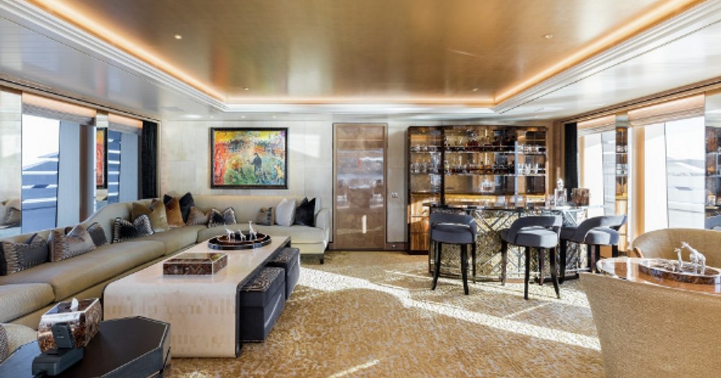 sofas and bar in the salon aboard motor yacht JOY 