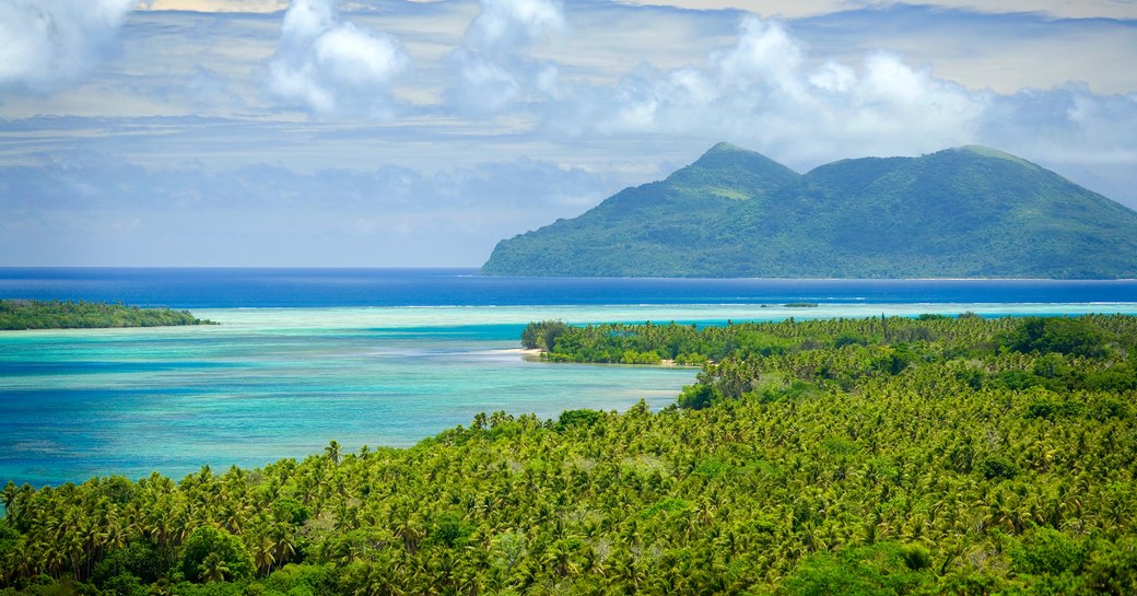 view of lush jungle and blue seas from sky deck in Vanuatu