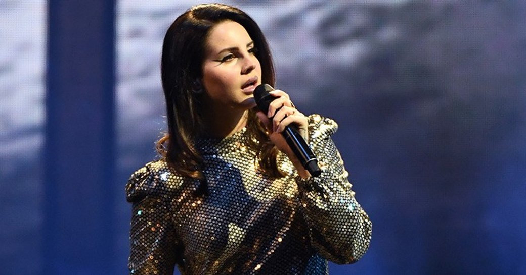 ethereal wonder Lana Del Rey performing in front of a stadium of fans on the main stage of Abu Dhabi Grand Prix