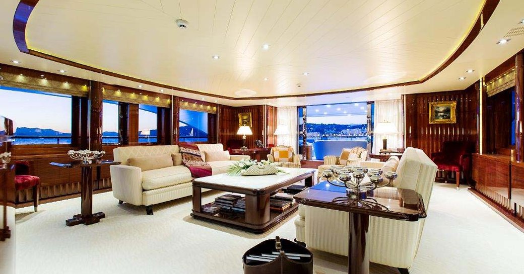 VERTIGO superyacht  main salon, with cream sofas and cream carpet