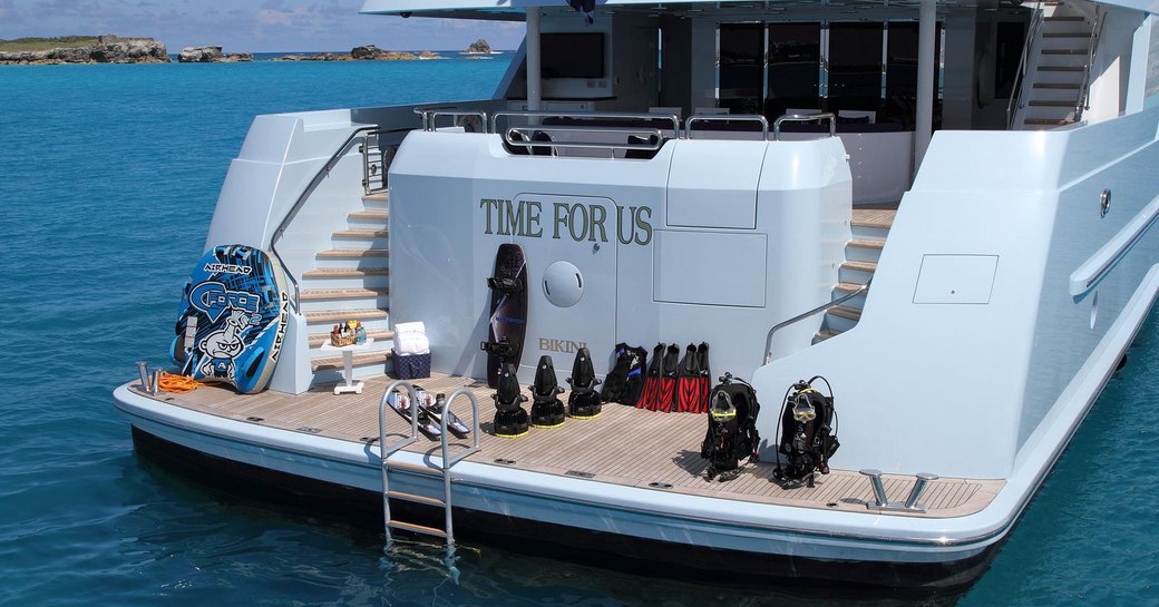 water toys lined up on the swim platform of superyacht Time For Us 