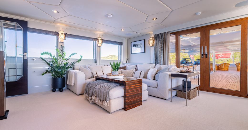 Charter yacht VICTORY interiors with seating area and large windows