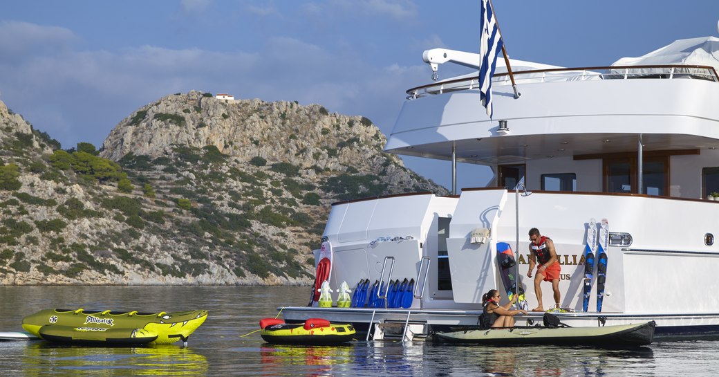 charter guests and crew on the swim platform with water toys on board luxury yacht ANCALLIA 