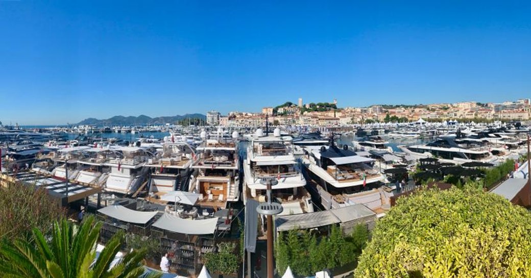 Yachts lined up along the harbour at Cannes Yachting Festival 2019