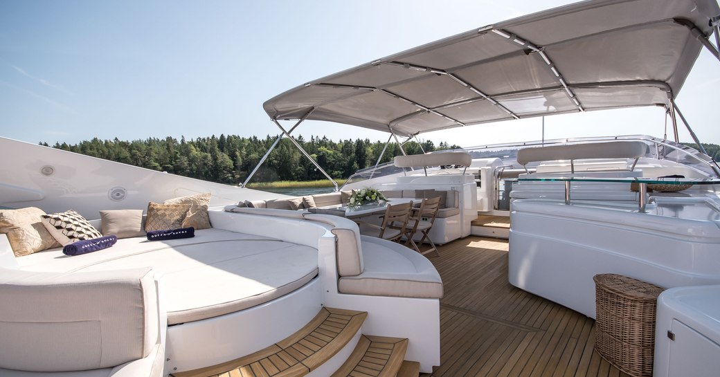 Sundeck on Superyacht Queen of Sheba, with light coloring and teak decking