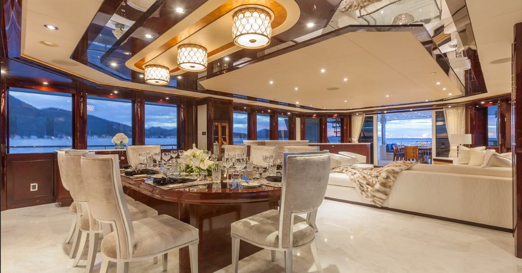 Formal interior dining on board luxury charter yacht