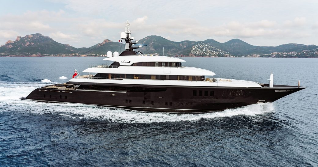 Superyacht charter LOON underway, surrounded by sea