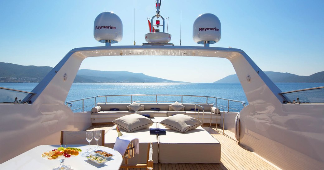 the outdoor deck of a luxury charter yacht