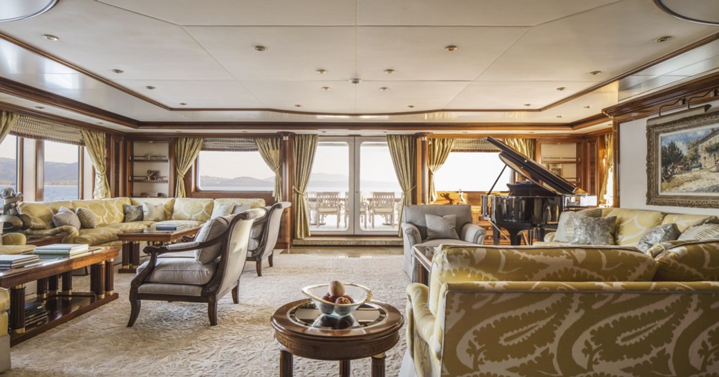 classically styled main salon with grand piano and sofas aboard superyacht TITANIA 