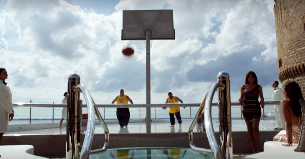 the spacious sundeck with basketball court of superyacht KISMET while she is cruising the waters of Italy during the filming of 6 underground