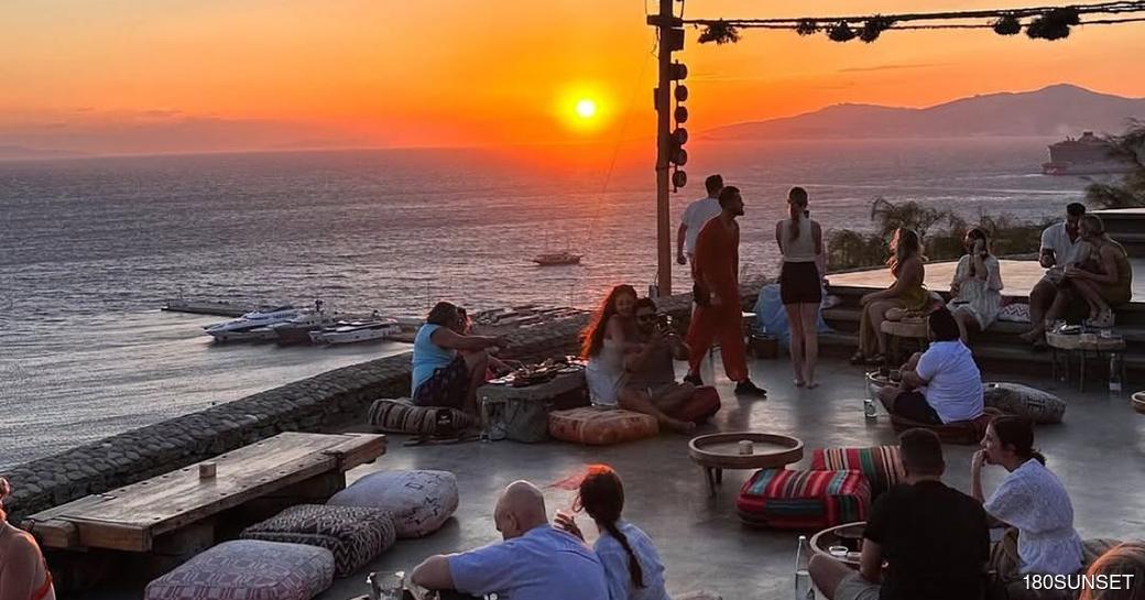 180 Sunset Bar with charter guests watching sunset