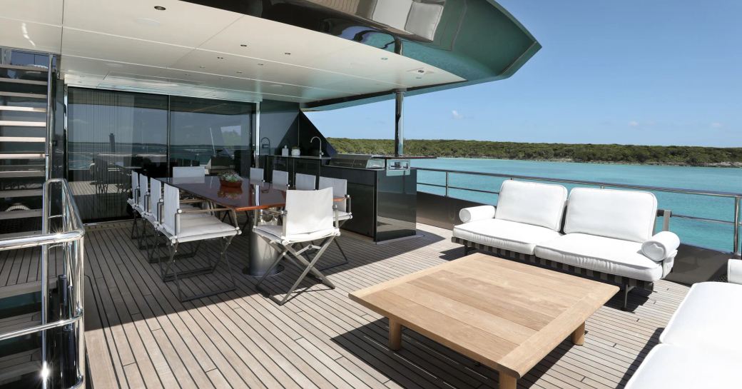 Exterior deck with furniture onboard charter yacht A SALT WEAPON